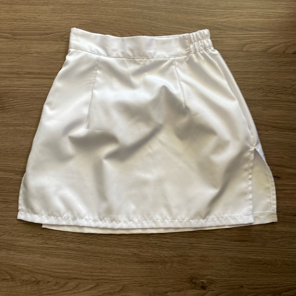 White mini pencil skirts with slits on sides